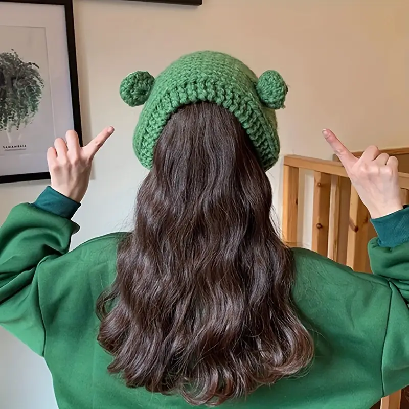 Faixa de cabelo tricotada com olho de sapinho