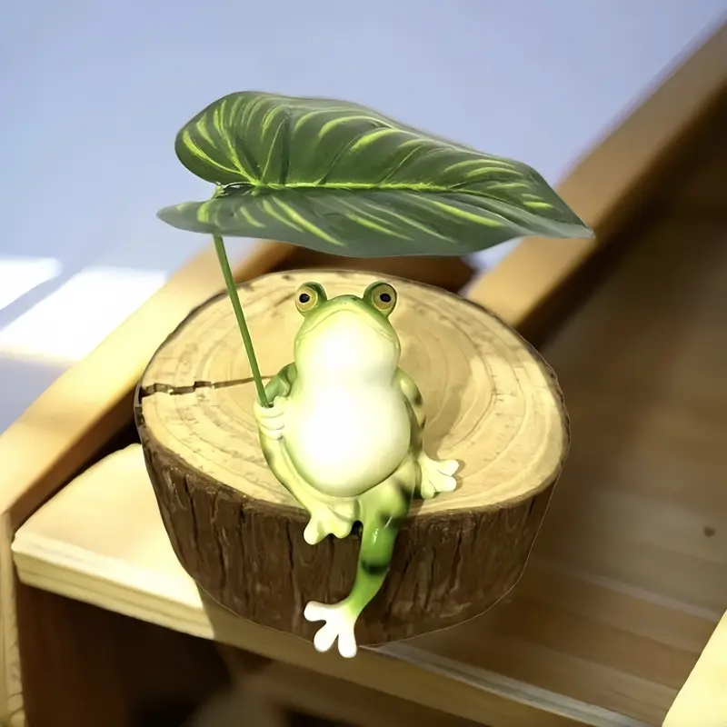 Sapo encantador segurando uma folha