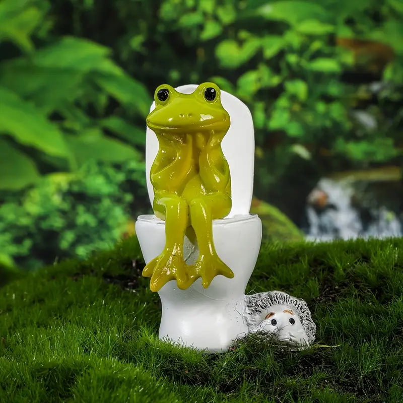 Sapo sentado na privada